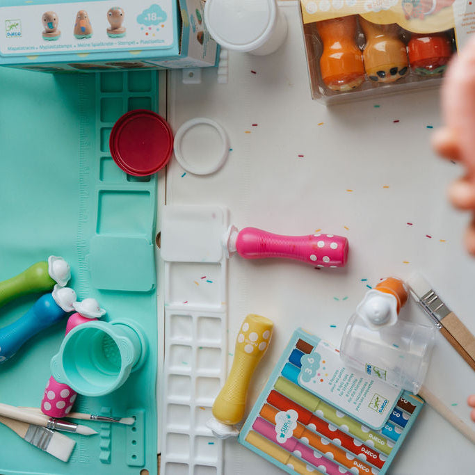 Children's play kitchen set with toy kitchen items on a table