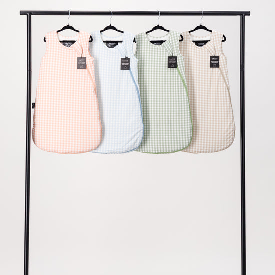 The MACCIE premium quilted bamboo winter sleep sack collection available in multiple prints and colors for safe warm baby sleep training without bulky loose blankets.