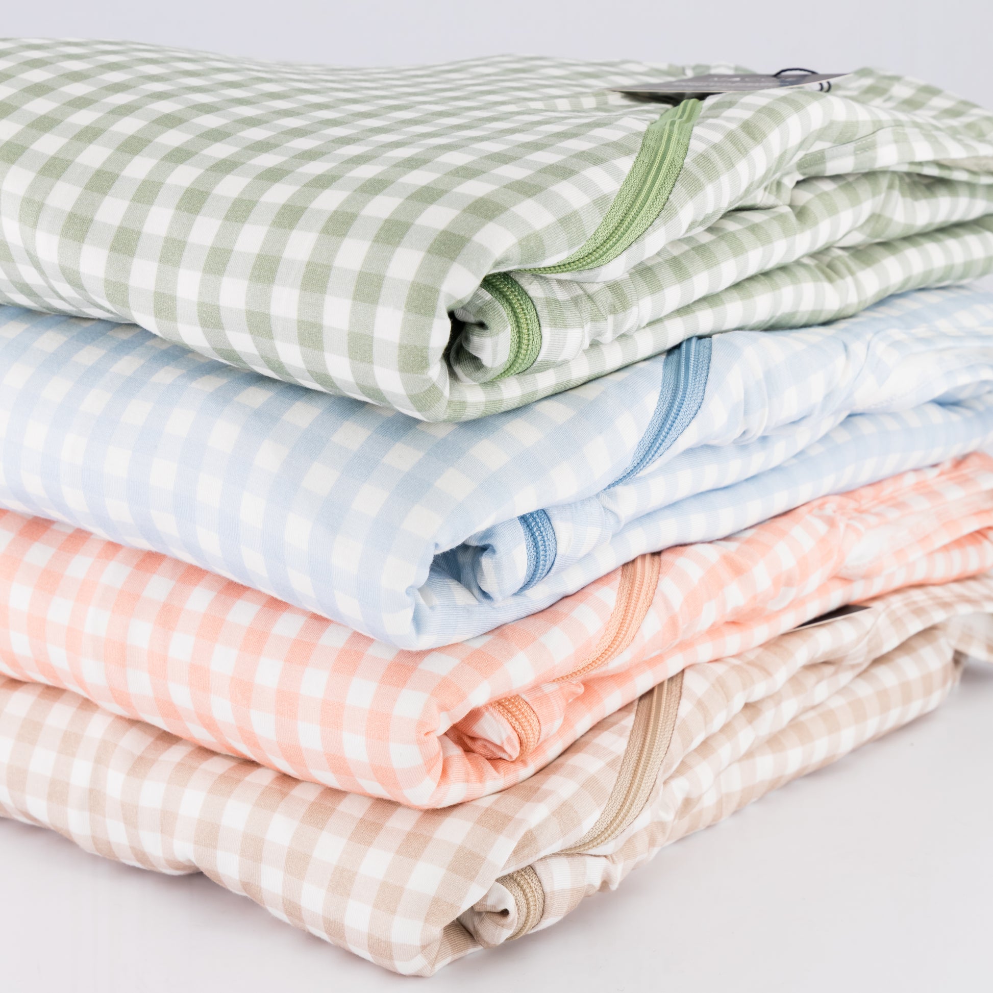The MACCIE premium quilted bamboo winter sleep sack collection available in multiple prints and colors for safe warm baby sleep training without bulky loose blankets.